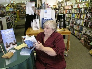 S.L. Winchester signing books for customers